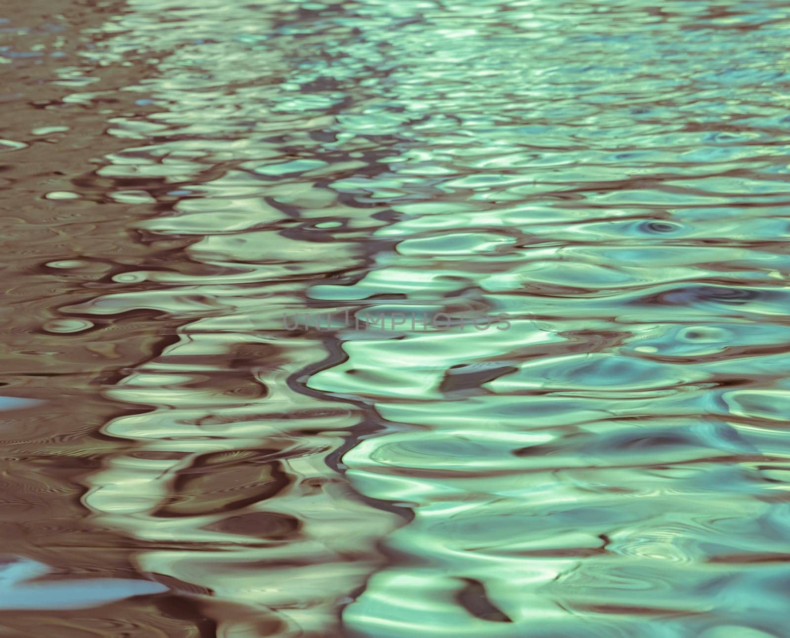 Blurred abstract background of light reflection on water motion