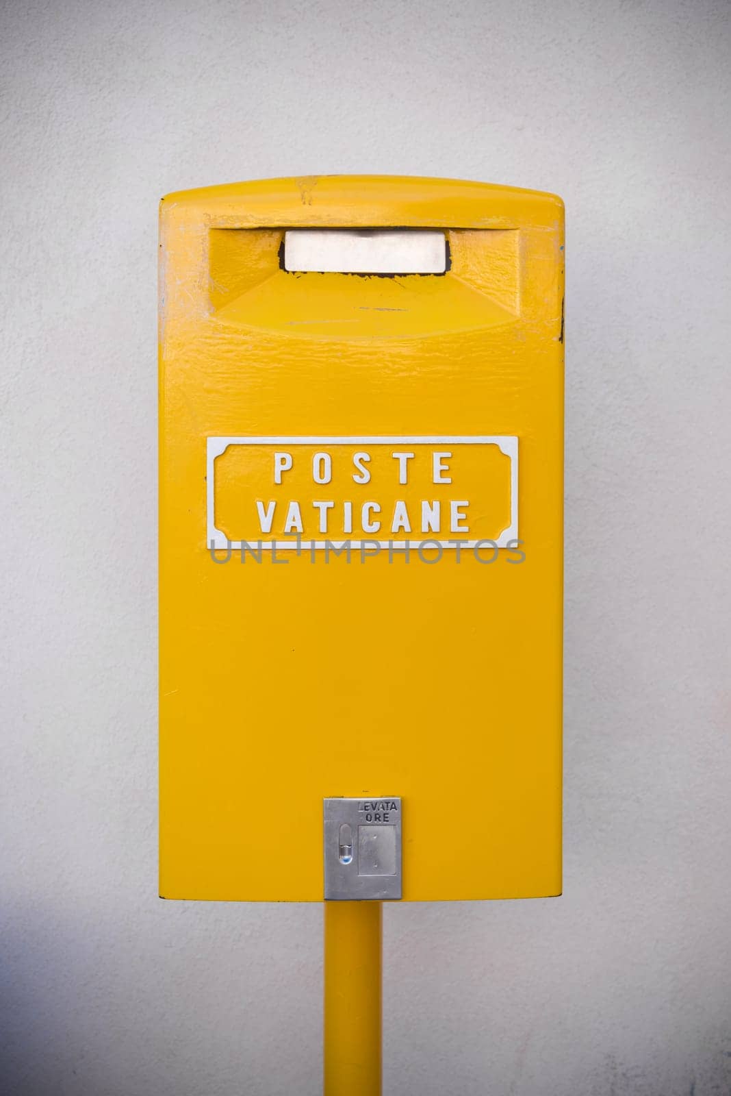 VATICAN CITY, VATICAN - OCTOBER 16, 2016: yellow post box on on piazza San Pietro in Rome, Italy