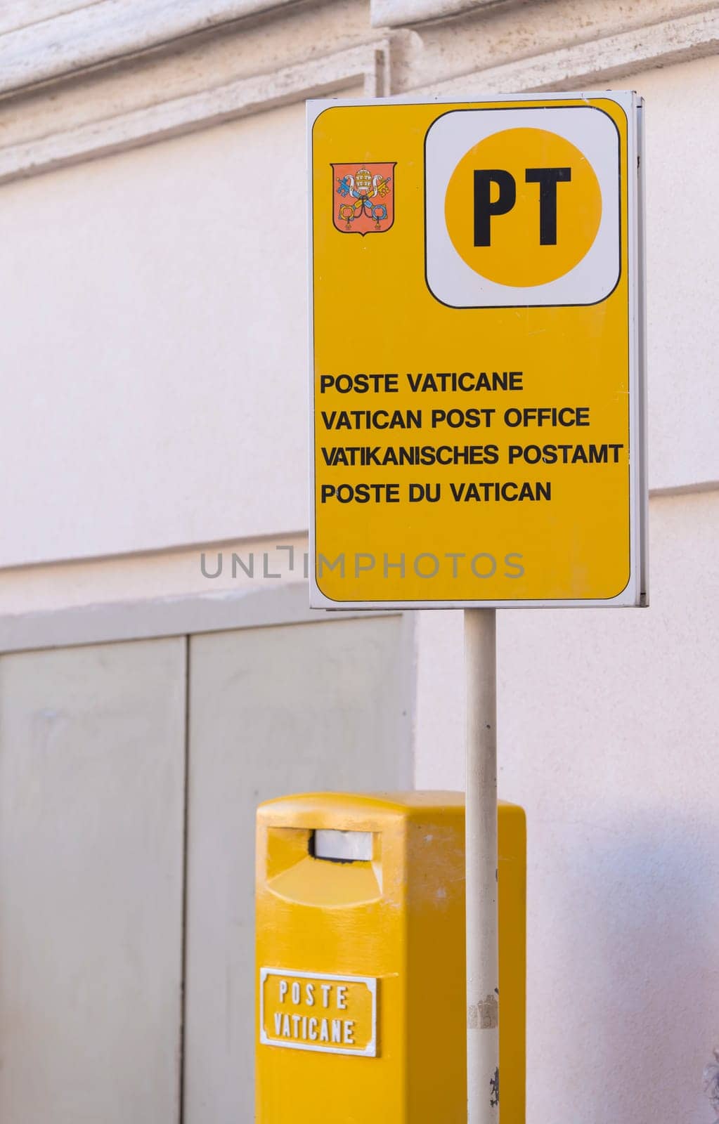 VATICAN CITY, VATICAN - OCTOBER 16, 2016: yellow post box on on piazza San Pietro in Rome, Italy