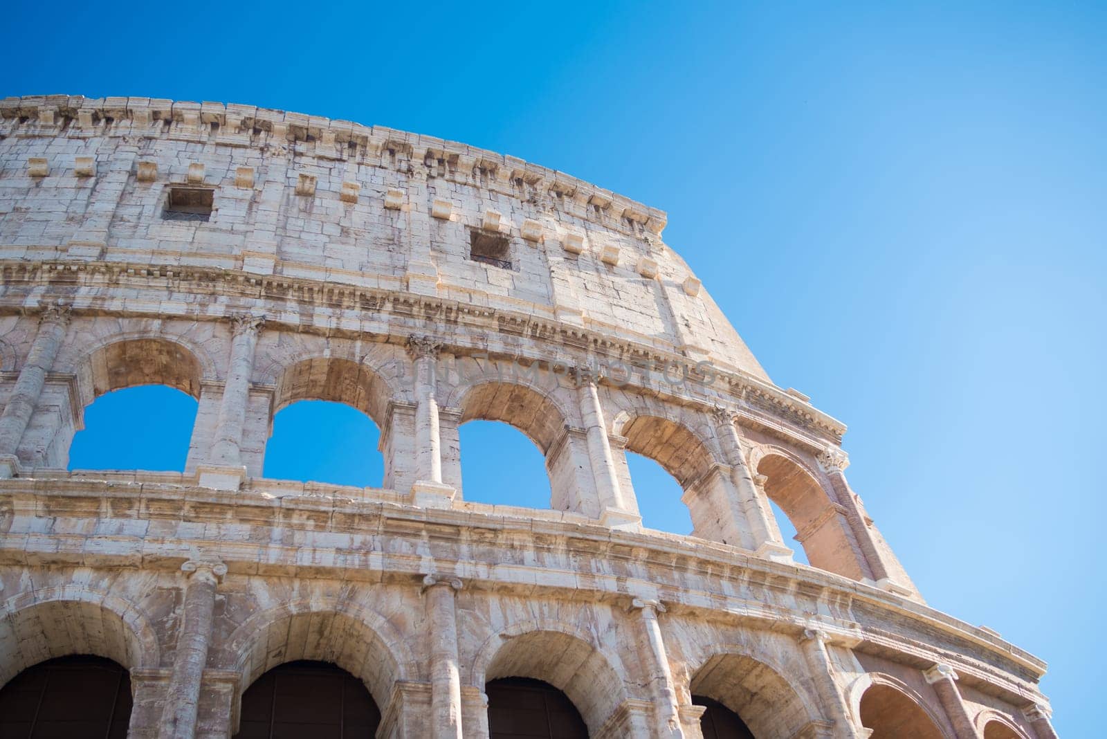 detail of the famous collosseum amphitheater in rome, italy