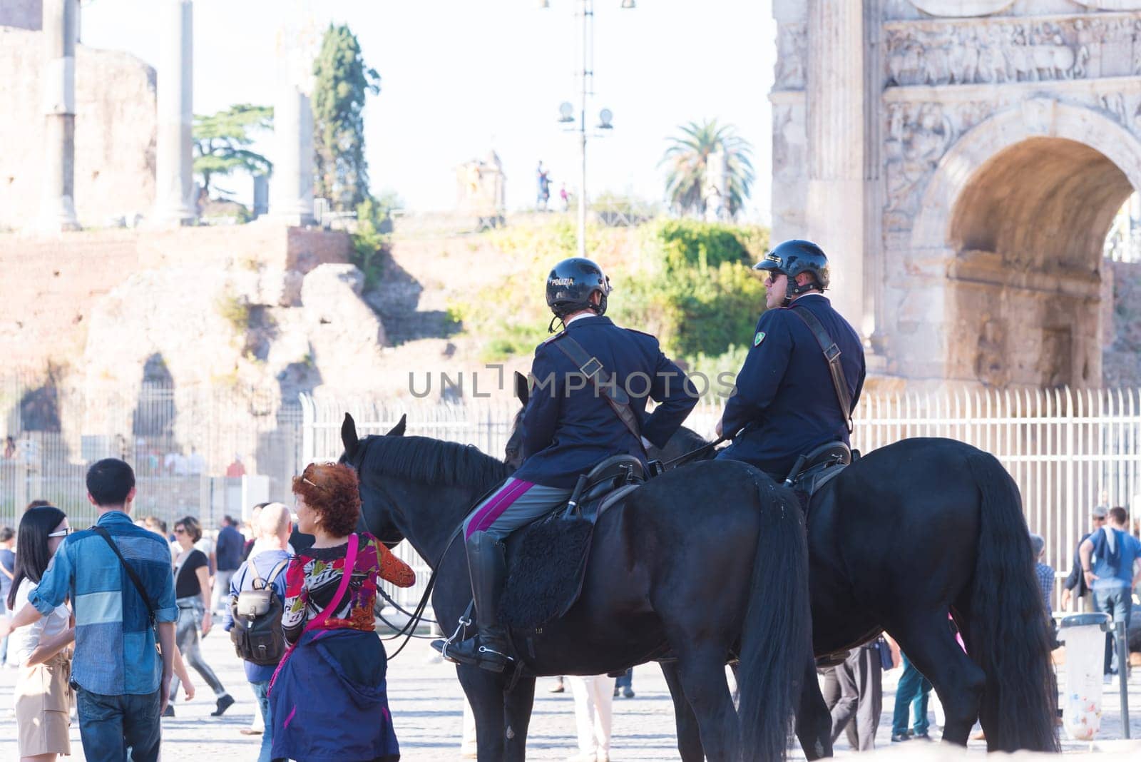 ROME, ITALY - OCTOBER 16, 2016: Two italian police men on horses at the collosseum