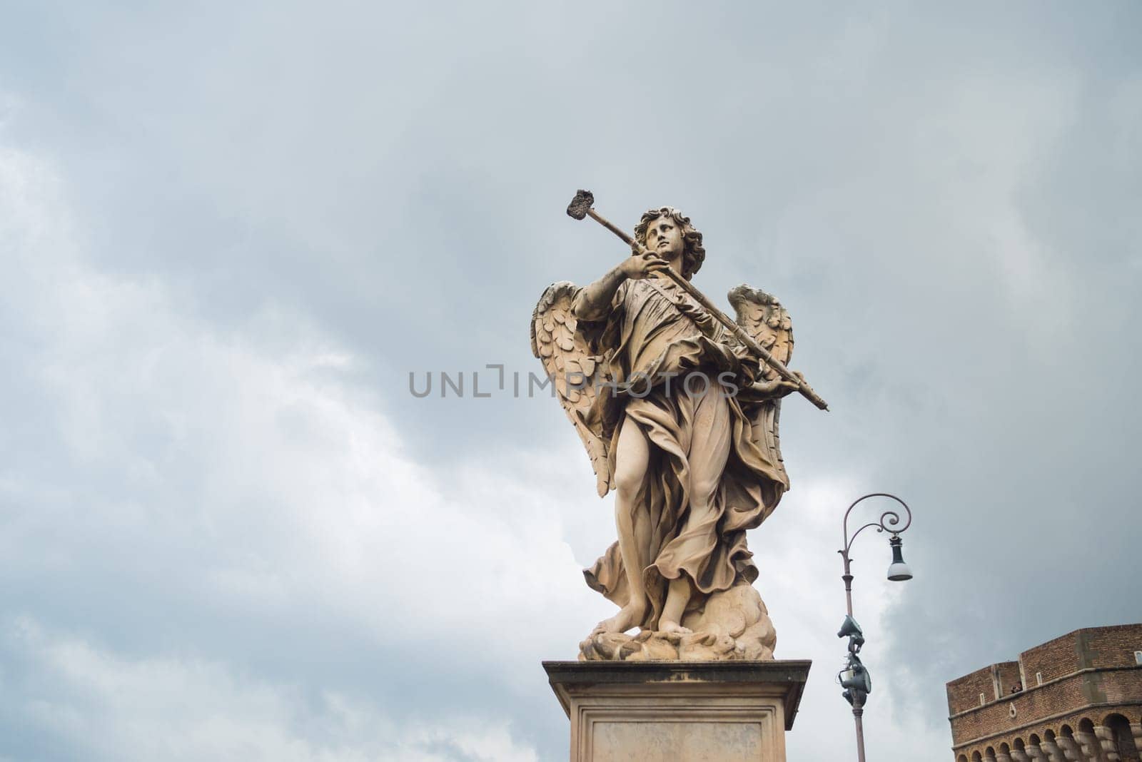marble statue of an angel on a tiber bridge
