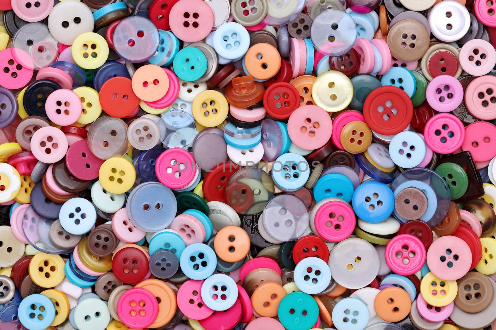 colorful background made from sewing buttons, pile of buttons