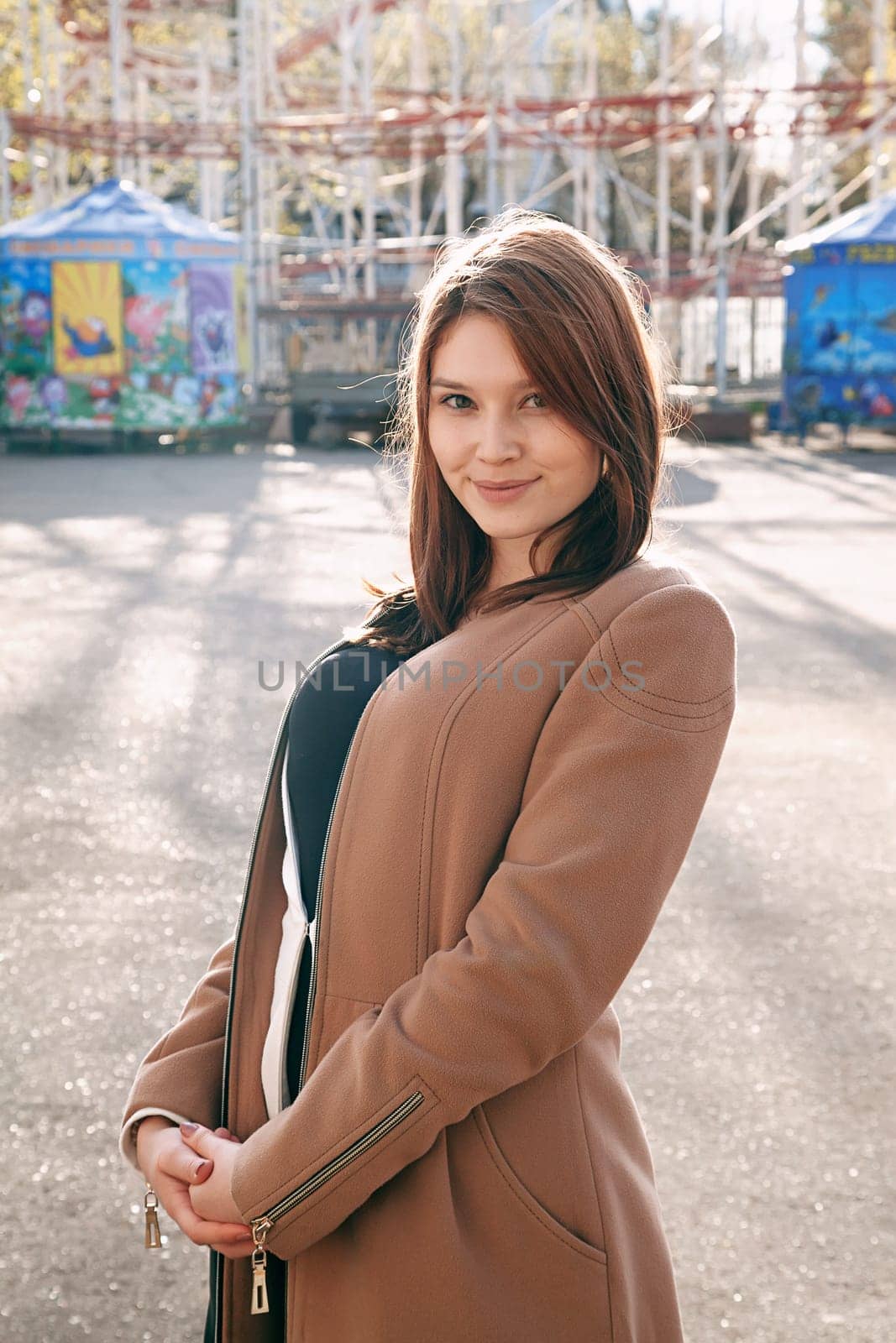 Urban girl standing out from the crowd at a city street.