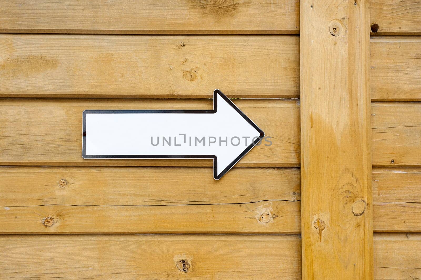 White pointer without text, on a wooden wall
