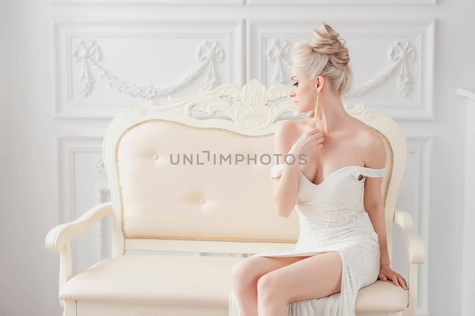 beautiful sexy woman in luxury interior glamour fashion. gorgeous blonde girl in hotel. vogue style fashion woman in trendy evening dress. Beauty and jewelry model. Rich woman at retro villa. Vintage