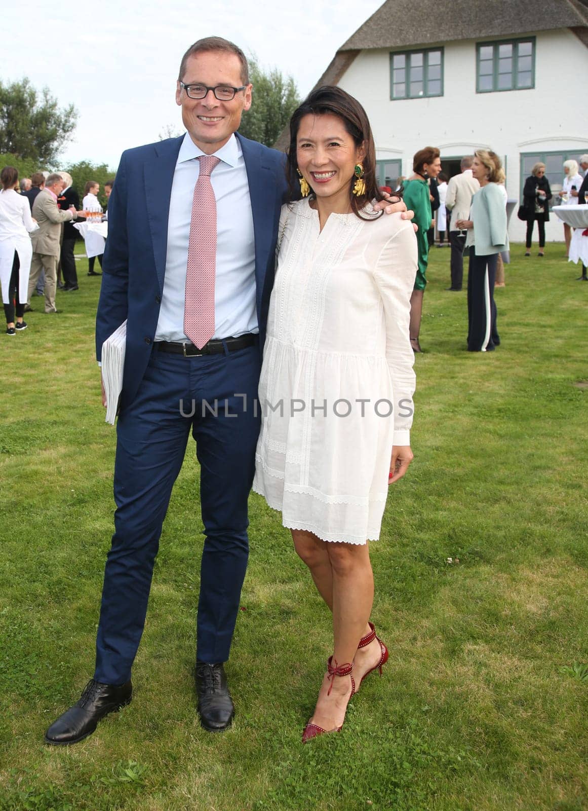 Roger Koeppel and wife Bich-Teen ,. Manfred Baumann invited to the yearly crab dinner in his house in Morsum - Sylt