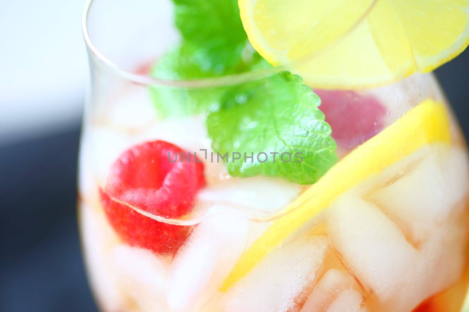 White wine with lemon, fresh raspberries and mint