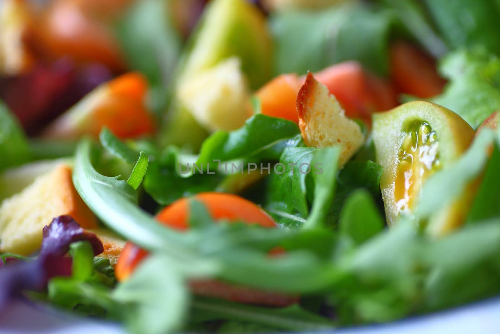 Salad of various lettuces and baby heirloom tomatoes with croutons