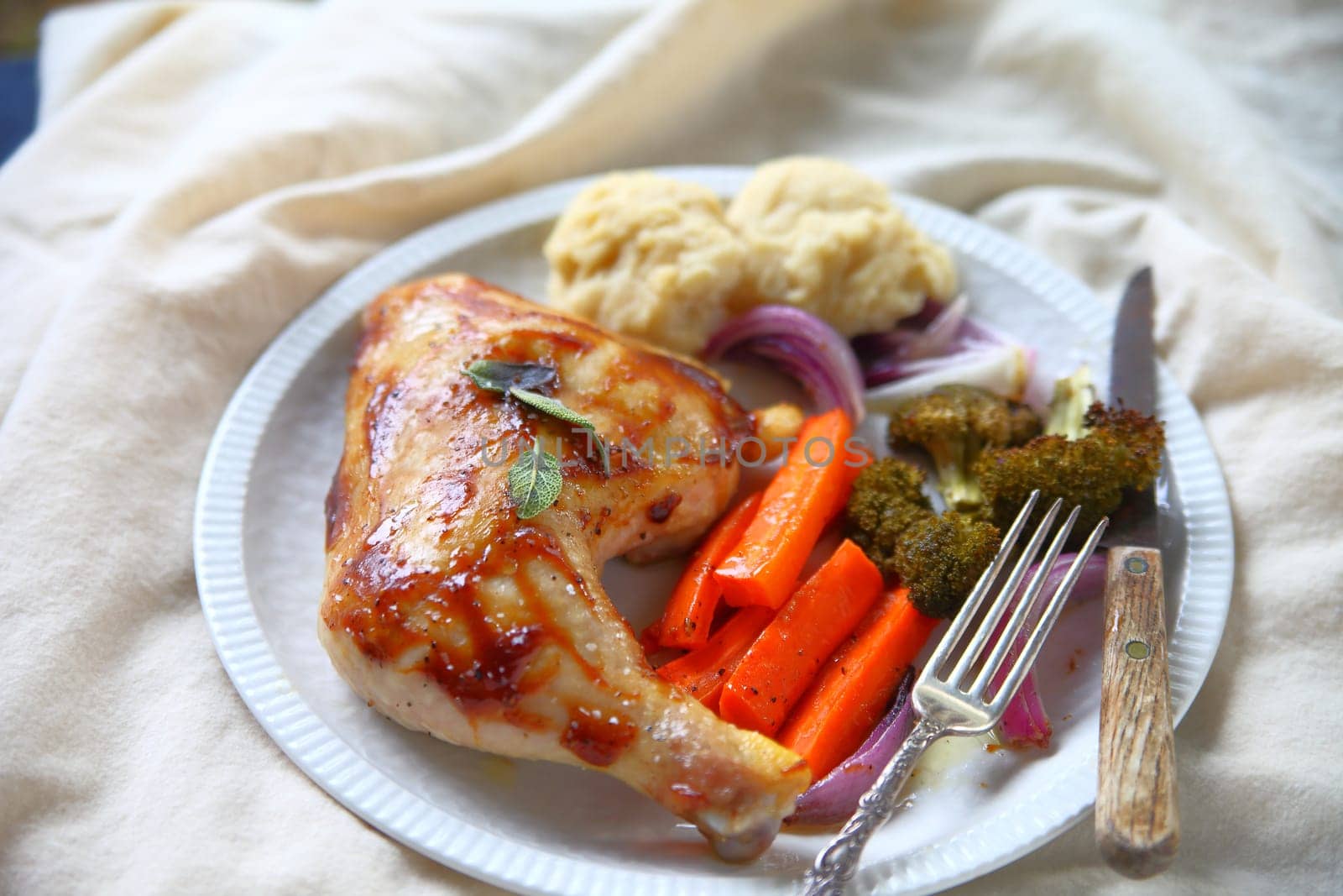 Chicken leg and thigh roasted with hoisin sauce, carrots and broccoli