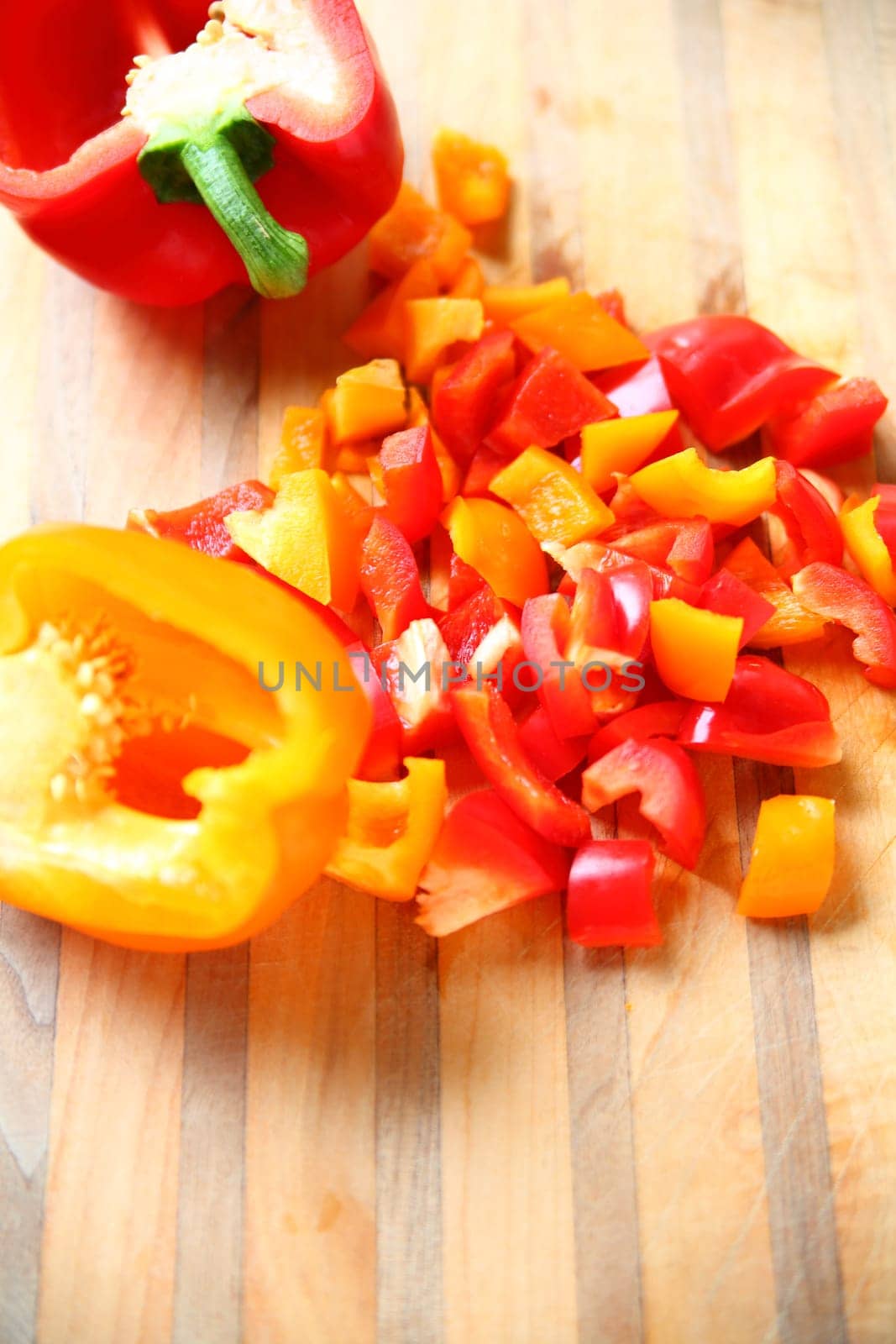 Cutting board with red and yellow peppers with room for text