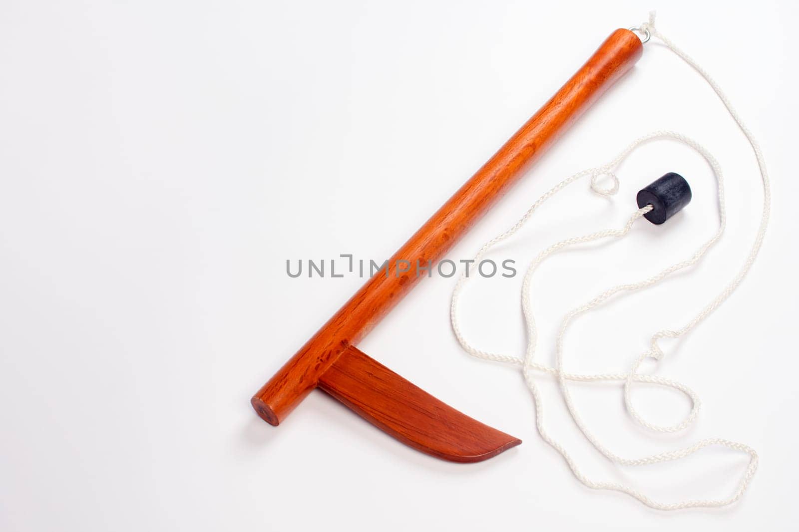 Wooden kusarigama, traditional Japanese weapon is on isolated white background.