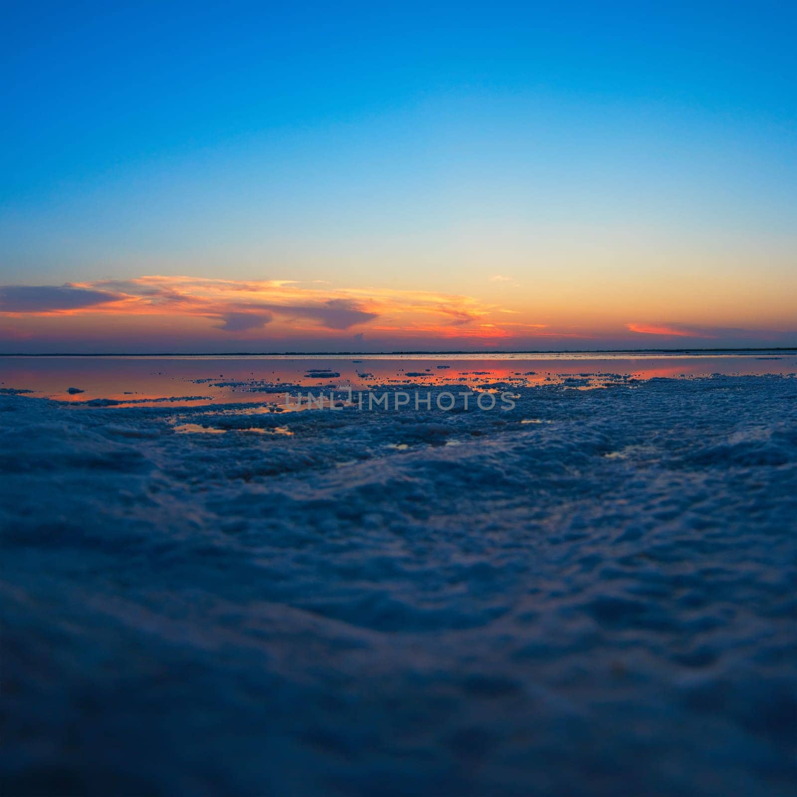 Beauty sunset on salty lake in Altay, Siberia, Russia