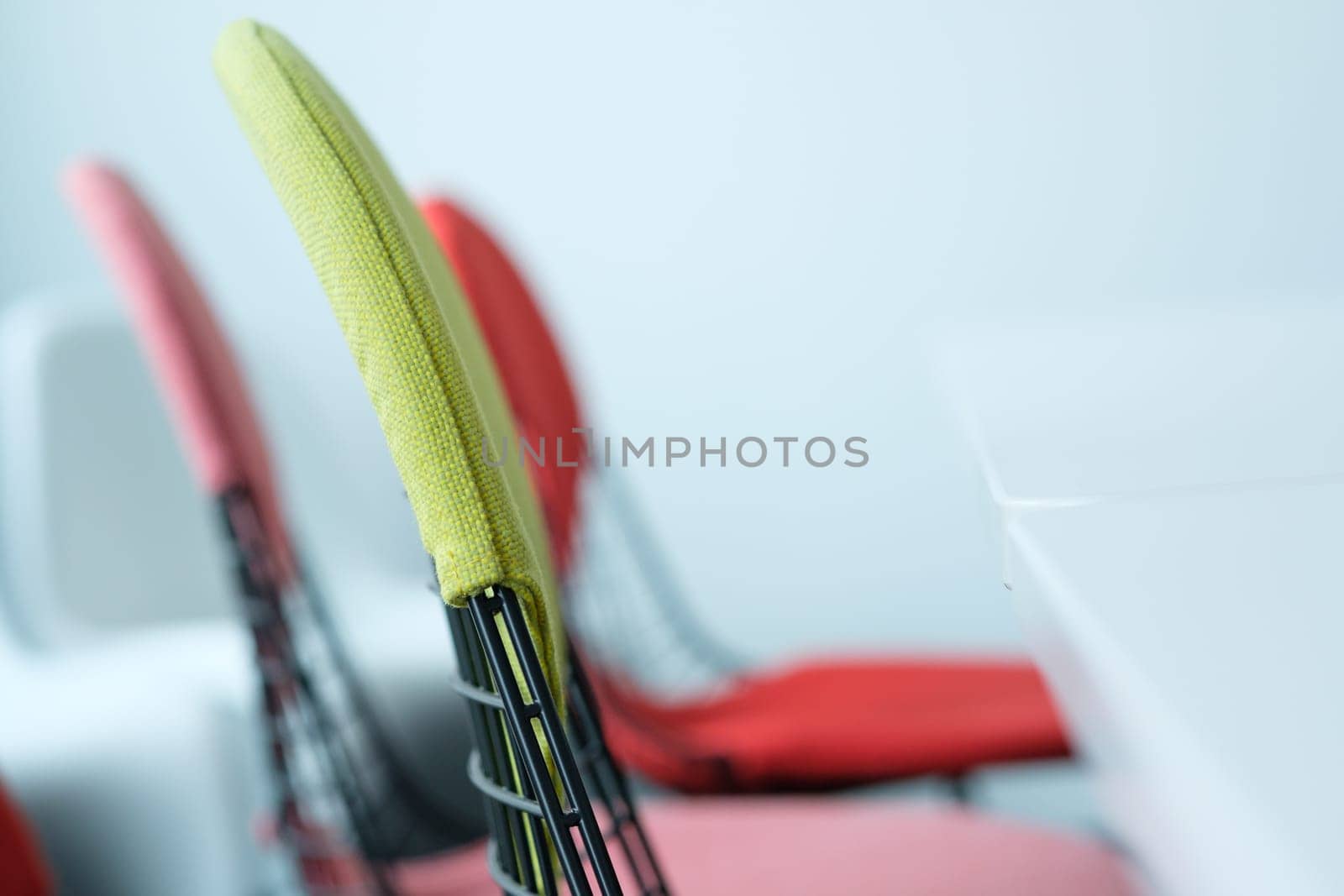 Chairs with backrest and table in a meeting room with blur