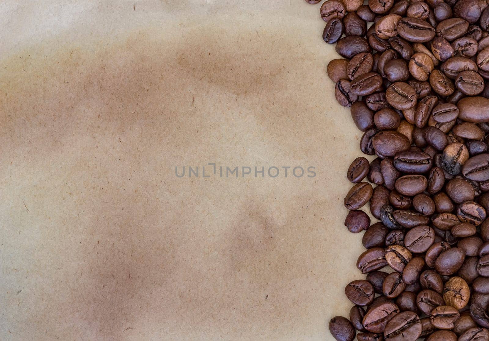 Coffee beans on a vintage paper background