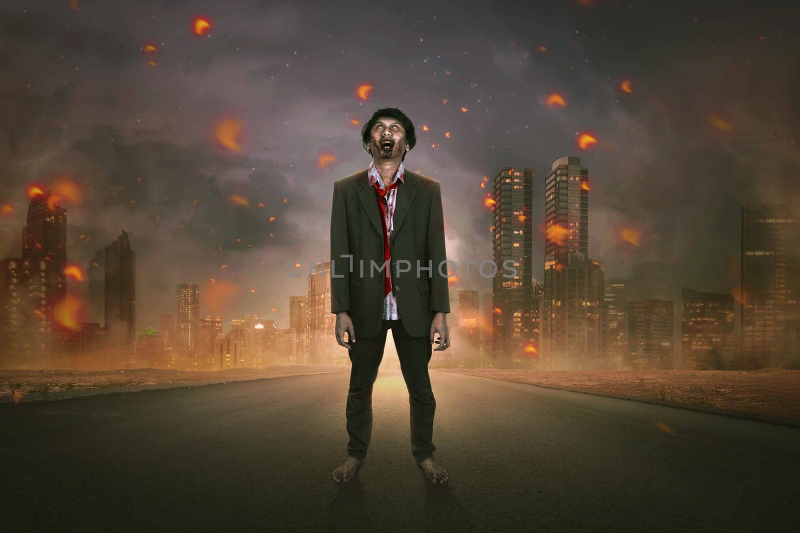 Portrait of creepy asian zombie man in suit standing on the street over burn city
