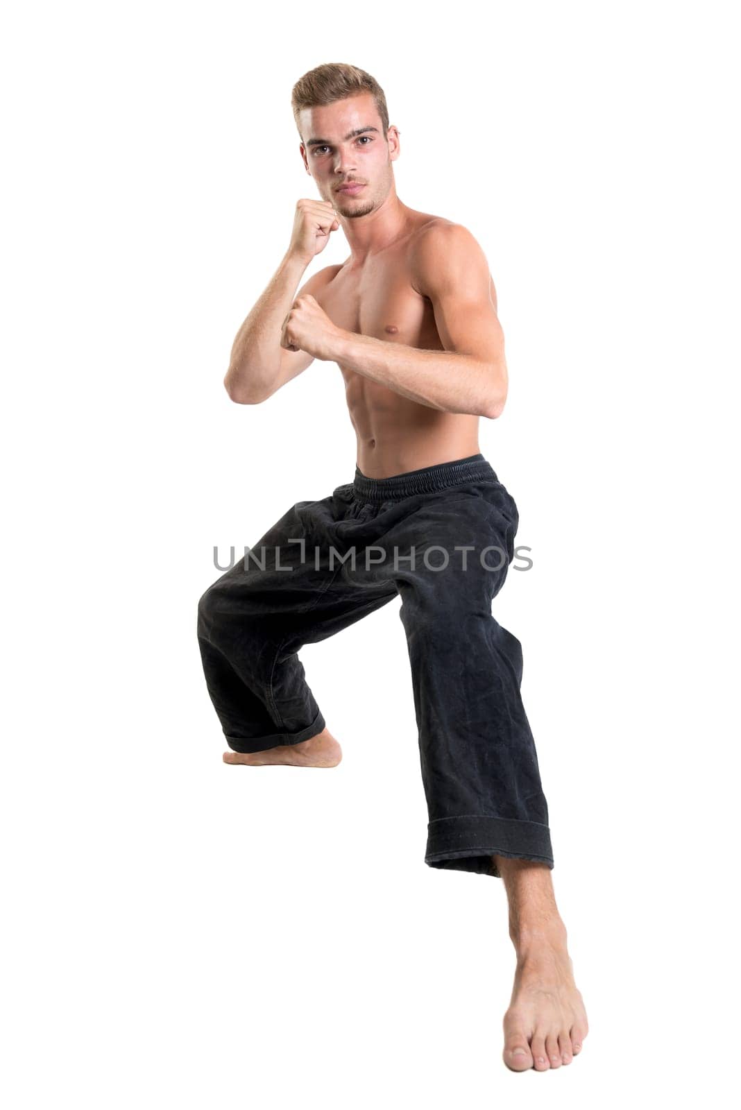 Martial arts student isolated in a white background