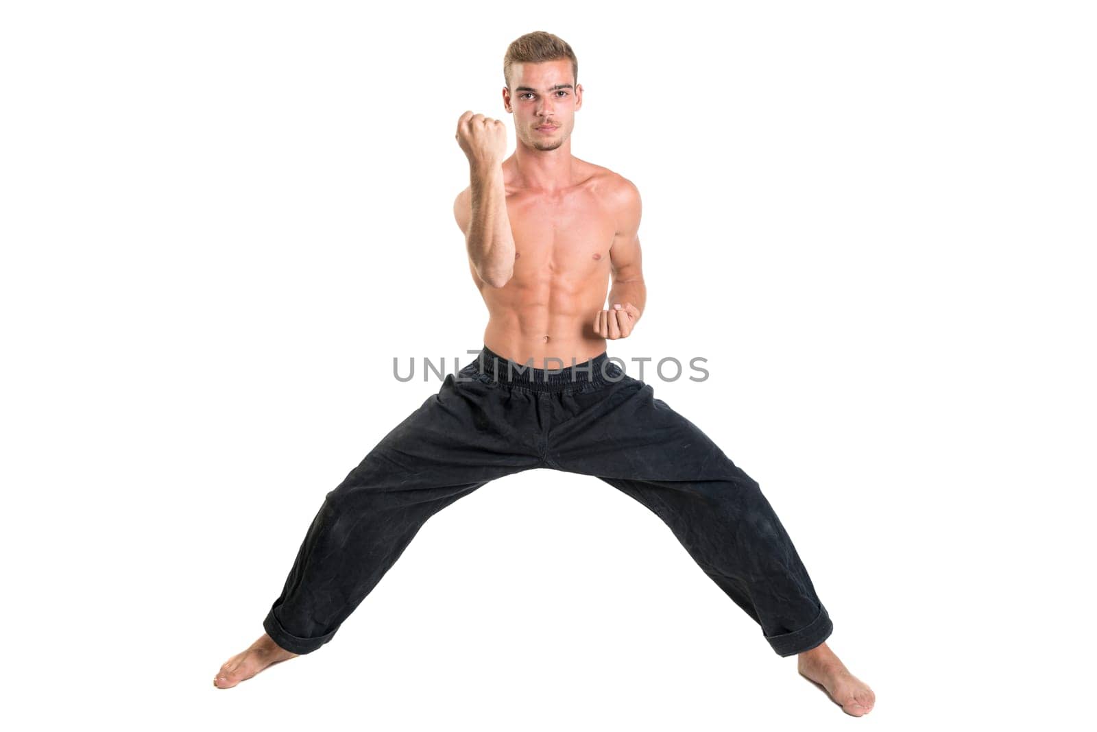 Martial arts student isolated in a white background