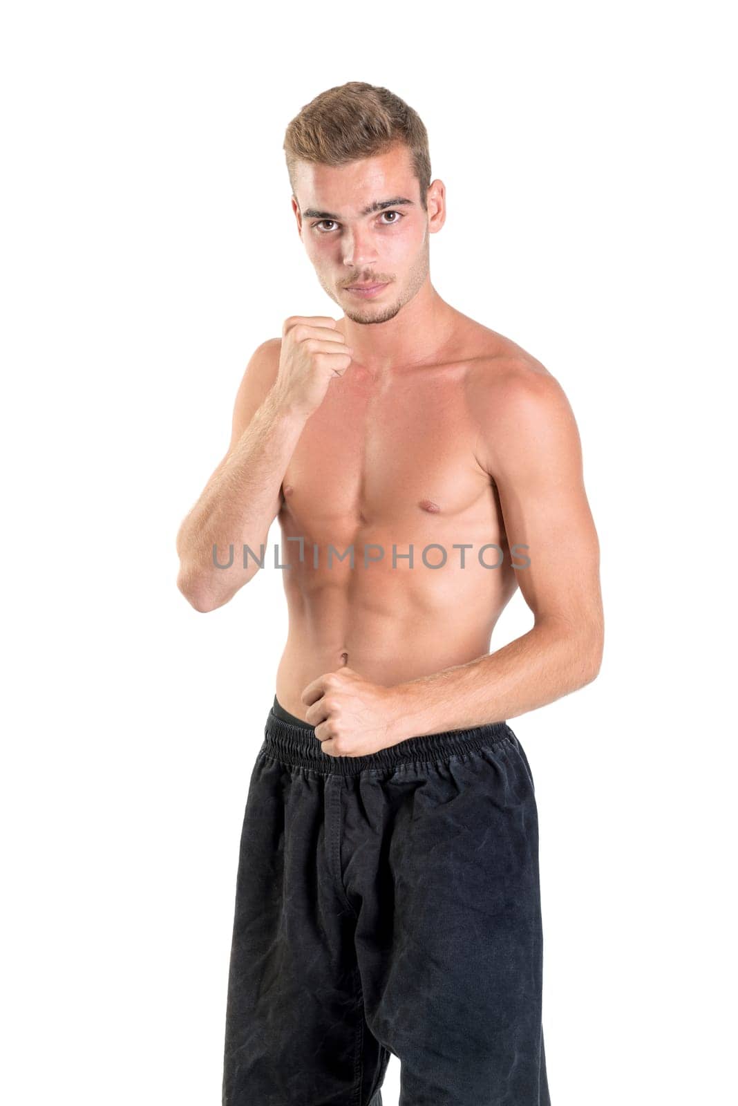 Martial arts student isolated in a white background