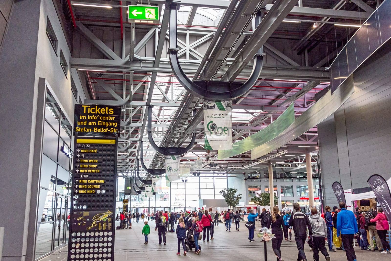 Nurburg, Germany - May 20, 2017: Race track Nurburgring, people in entrance hall - ticket info signboard in front