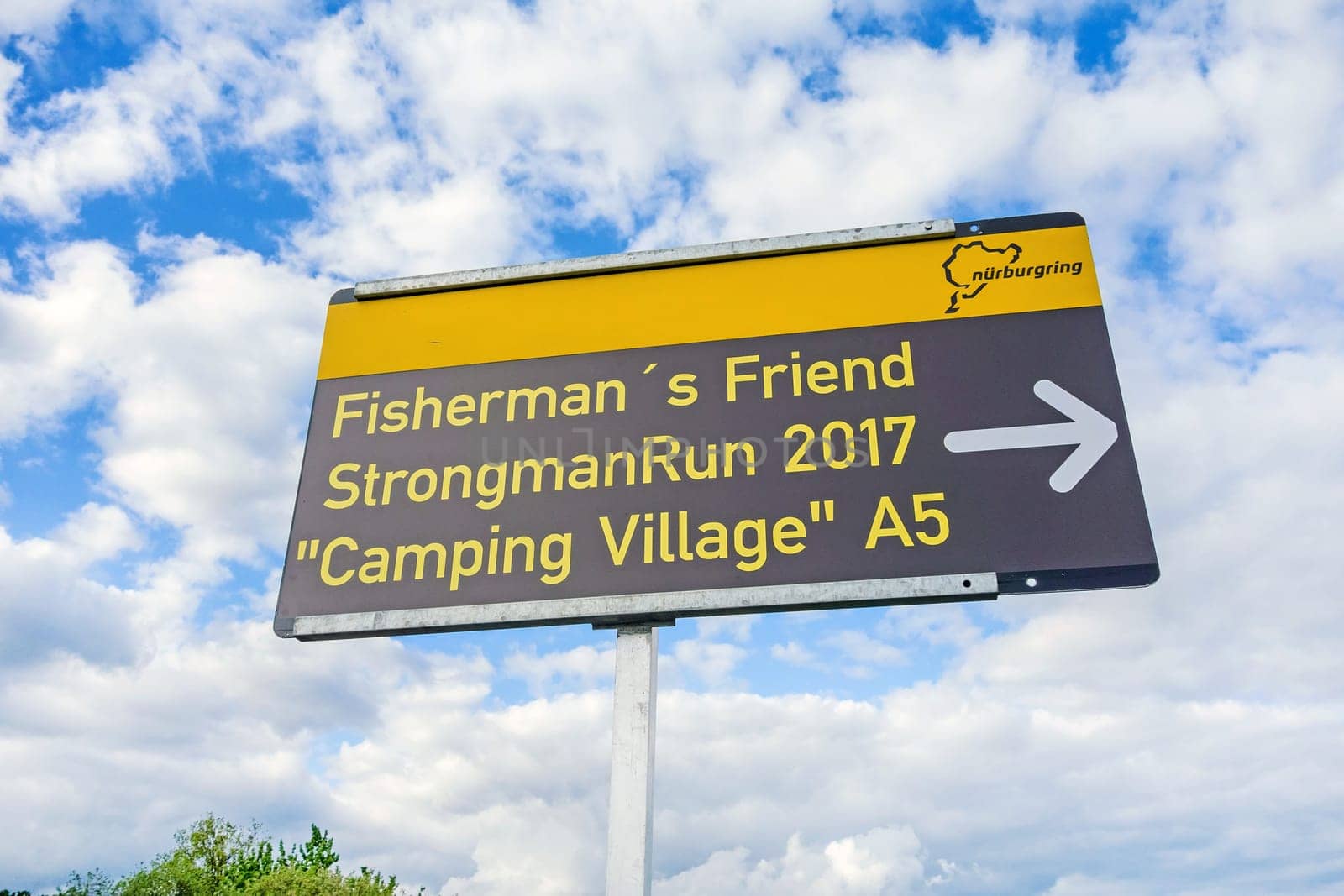 Nurburg, Germany - May 20, 2017: Event "Fisherman´s Friend StrongmanRun 2017"" - an obstacle course at race track Nurburgring / Eifel - sign showing the entrance to Camping Village A5."