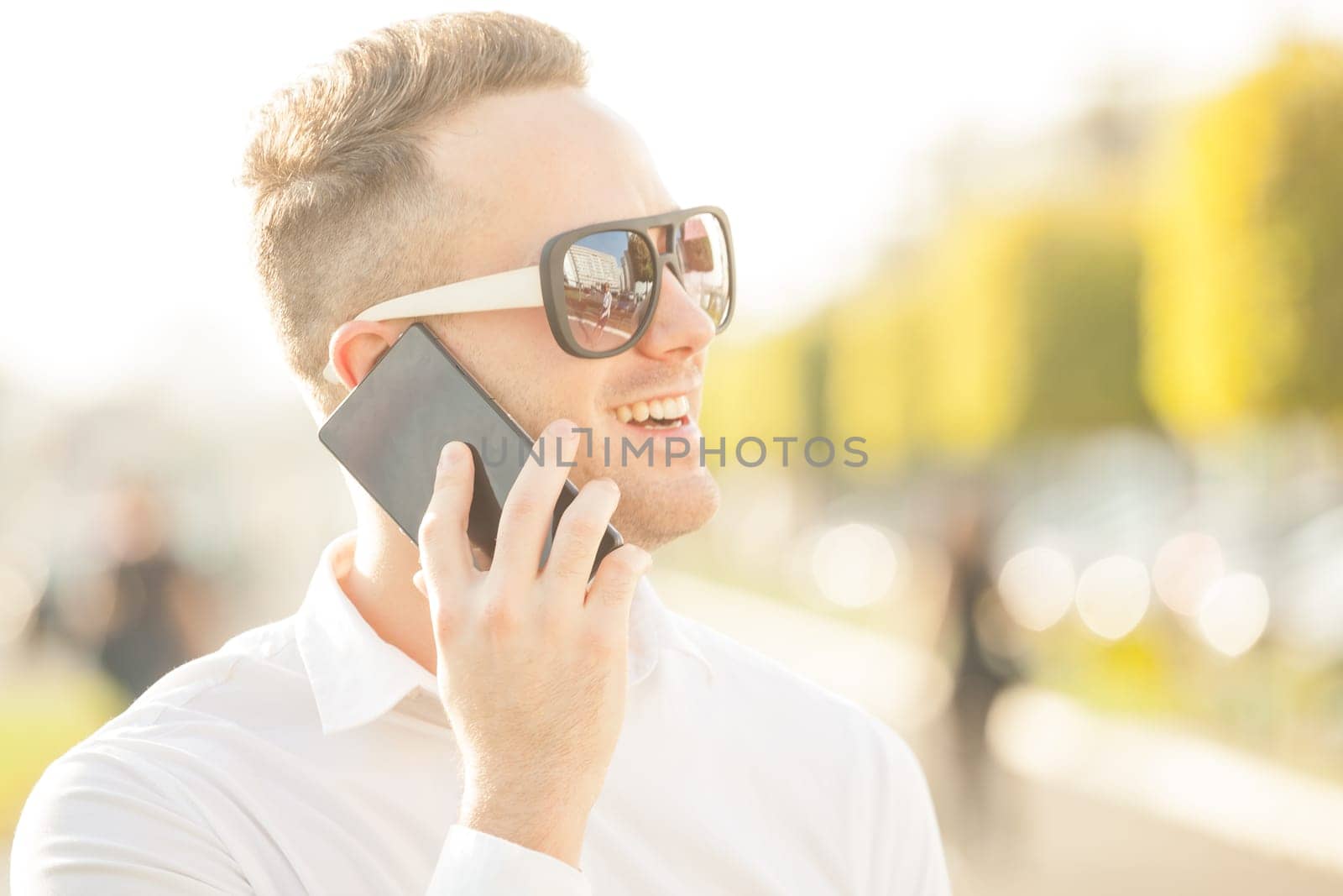 Traveling Man With Mobile Phone And Hat, In City, Urban Space