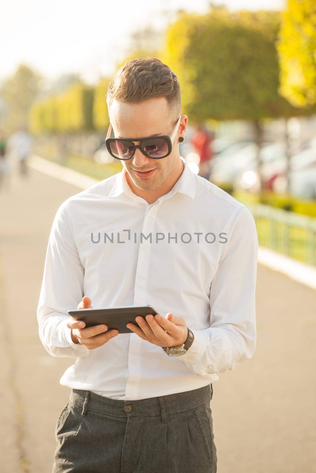 Traveling Man With Mobile Phone And Hat, In City, Urban Space