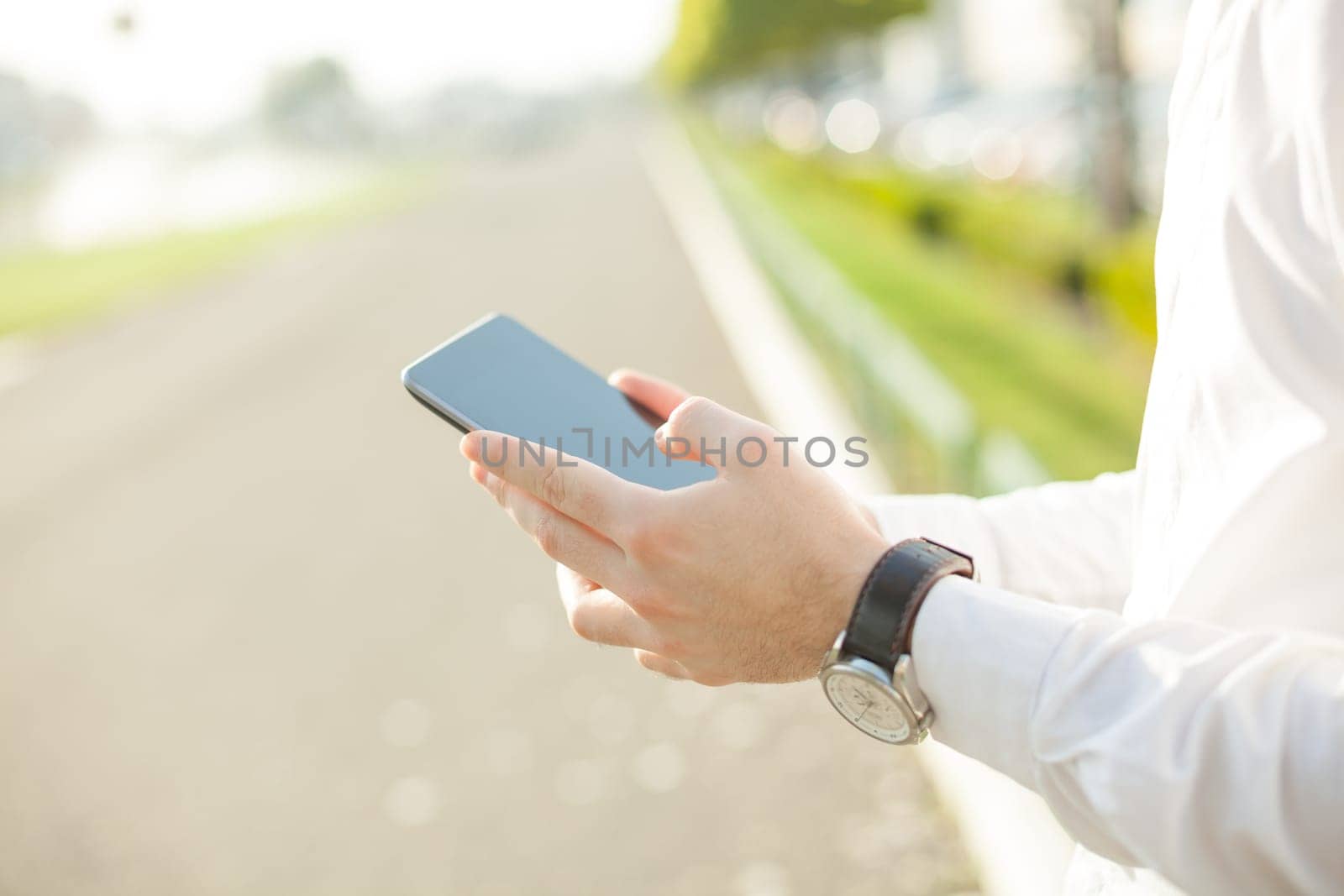 Close up of young man hands using touchscreen on digital tablet