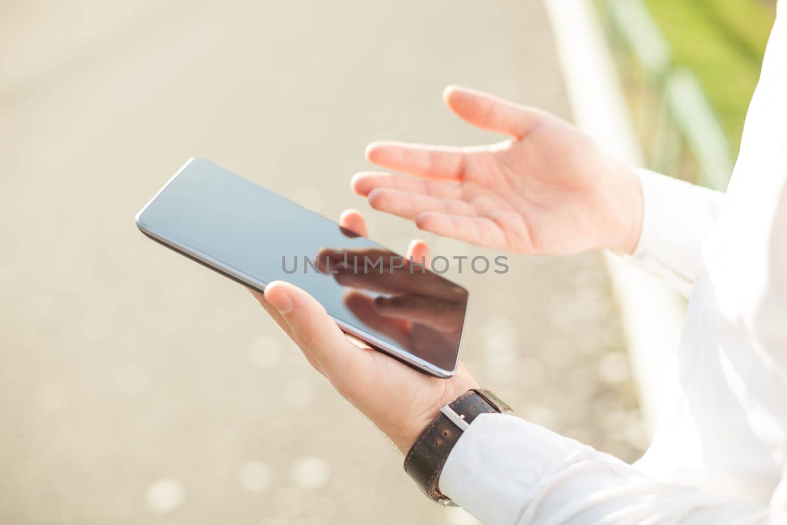 Close up of young man hands using touchscreen on digital tablet