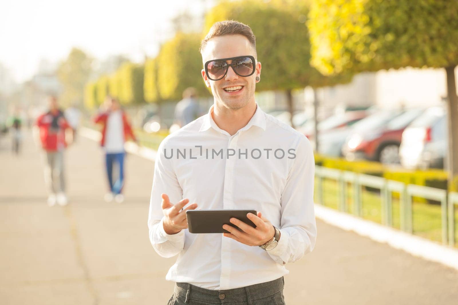 Traveling Man With Mobile Phone And Hat, In City, Urban Space