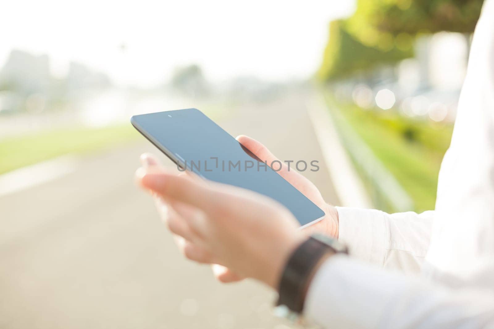 Close up of young man hands using touchscreen on digital tablet