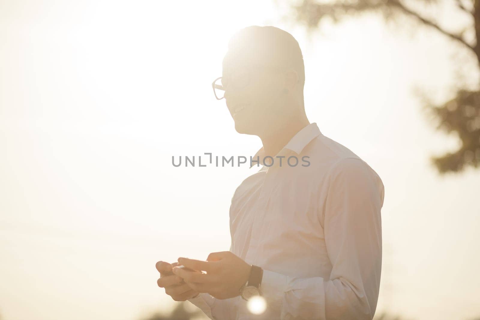 Man with glasses speak on mobile phone, In City, Urban Space, Park