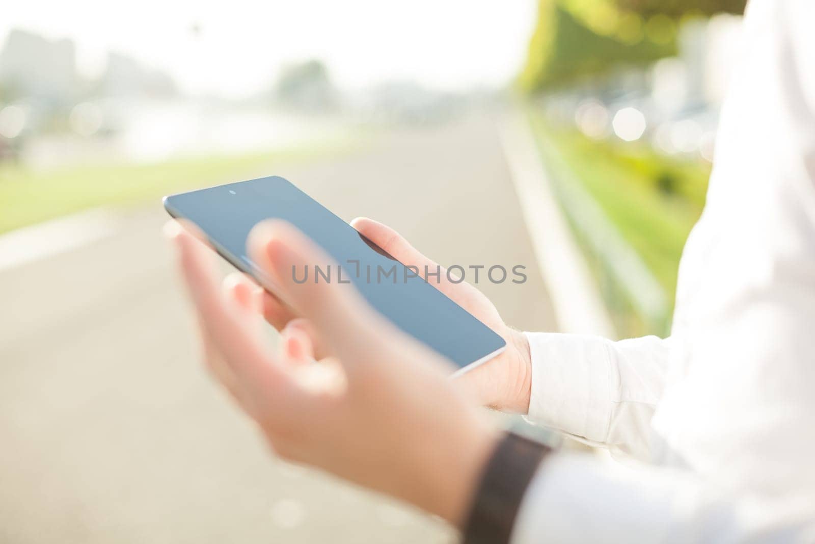 Close up of man hands using touchscreen on digital tablet