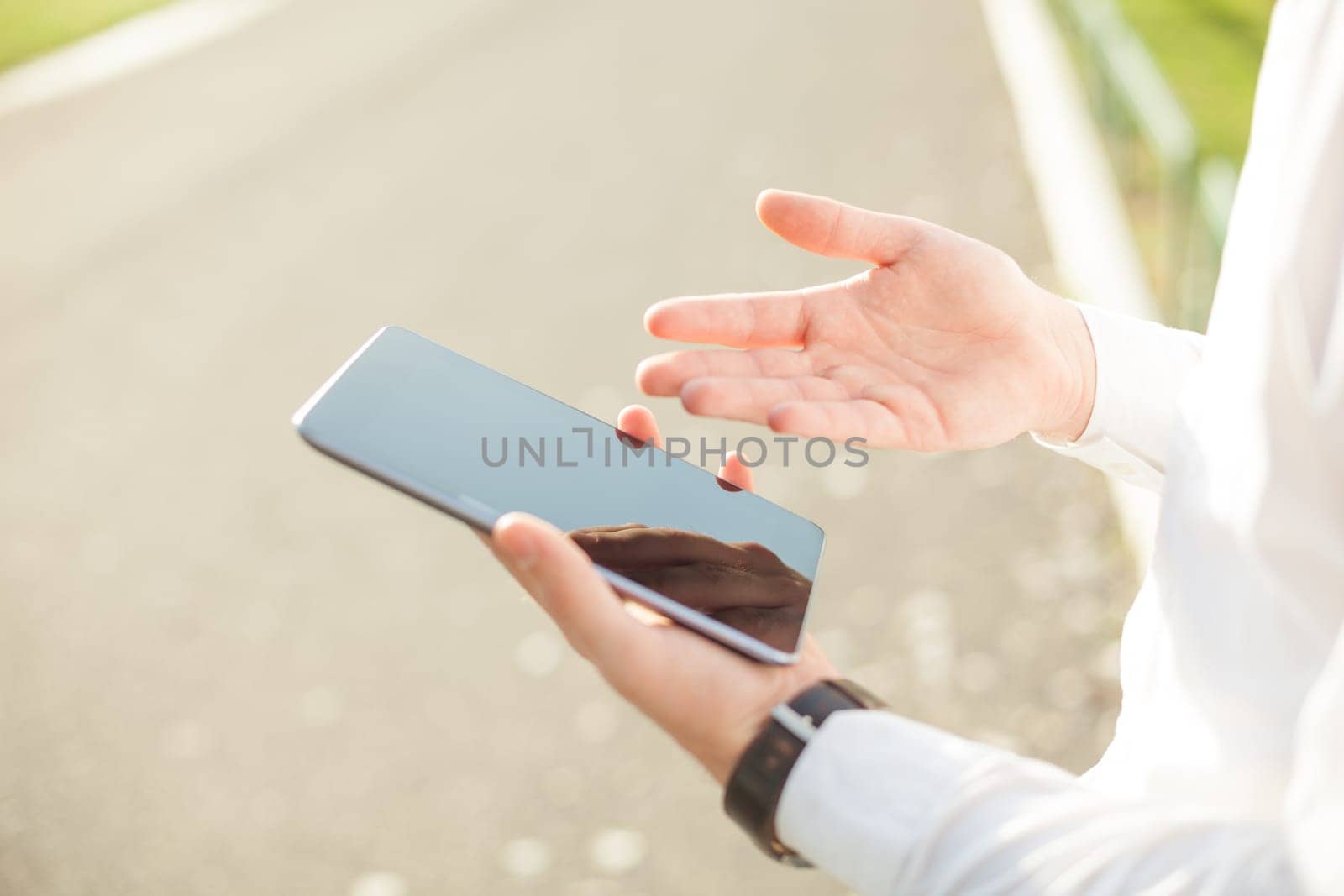 Close up of man hands using touchscreen on digital tablet