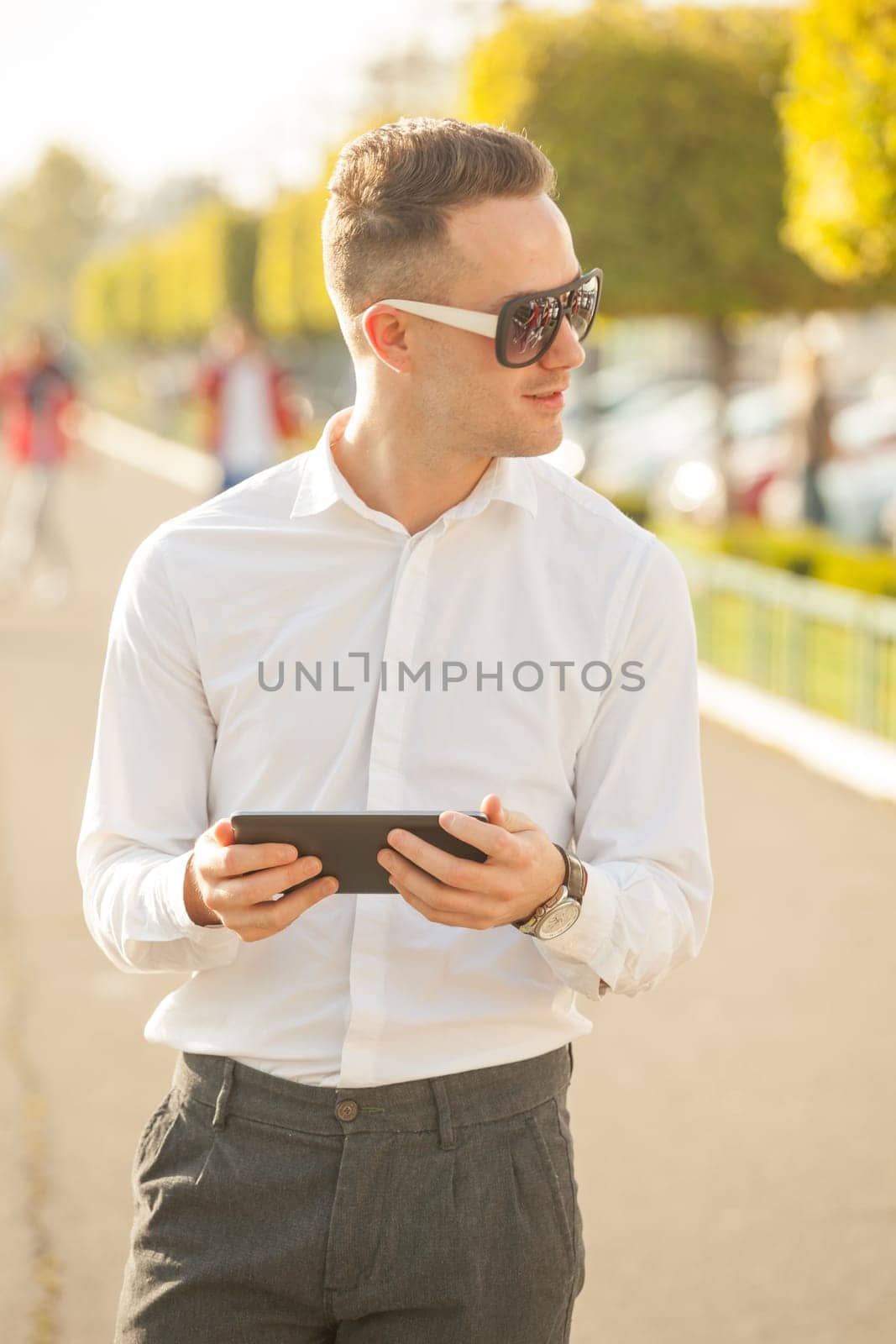 Traveling Man With Mobile Phone And Hat, In City, Urban Space
