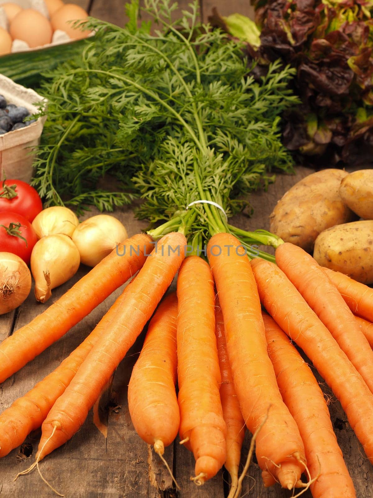 Healthy food concept with fresh vegetables on a rustic wooden kitchen table