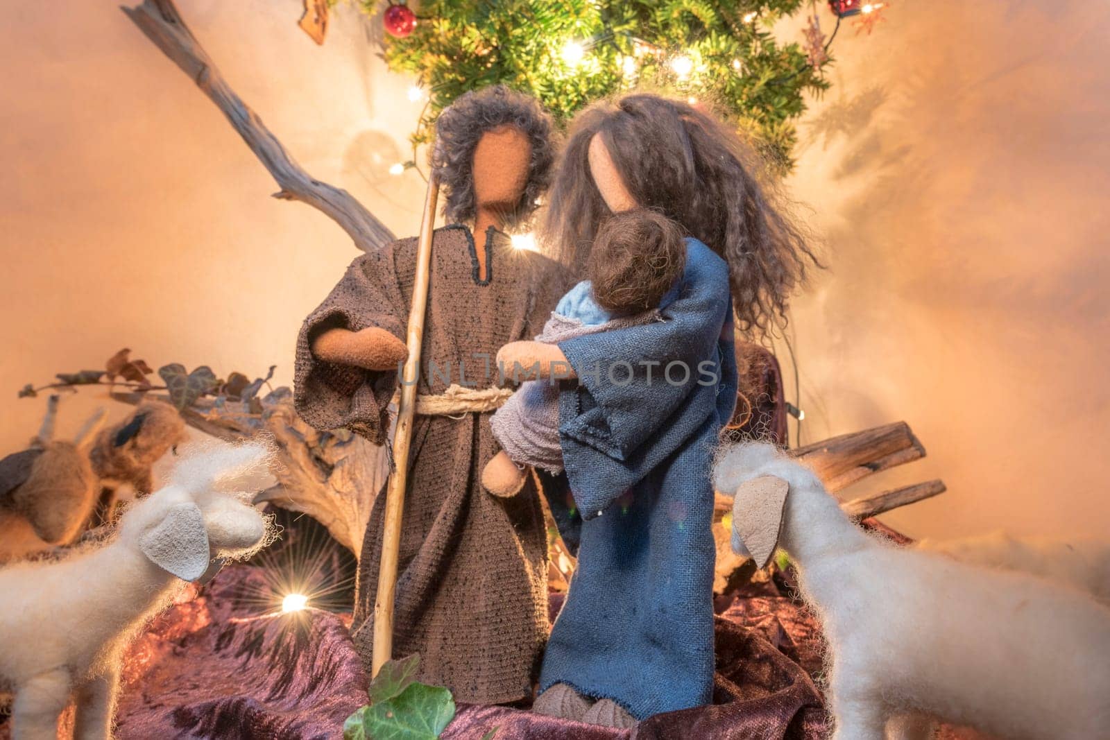 Adam and Eve at Christmas as rag dolls with stuffed animals and Christmas tree