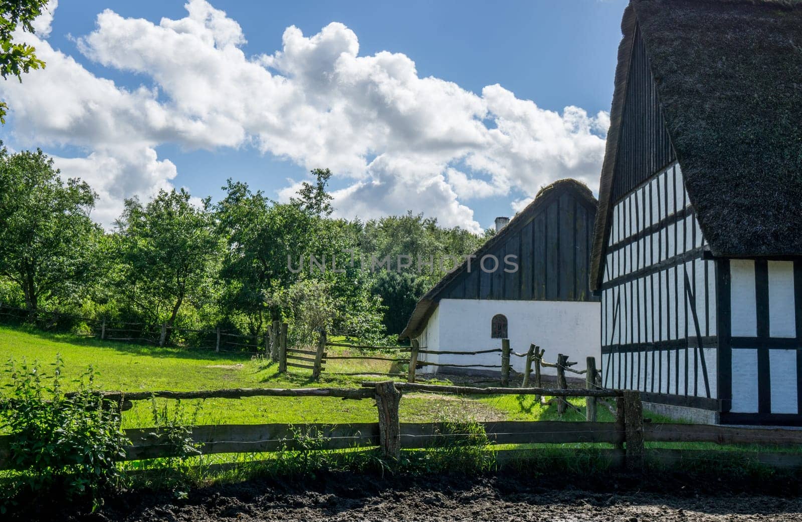 Farmland with old fence around and timbered buildings