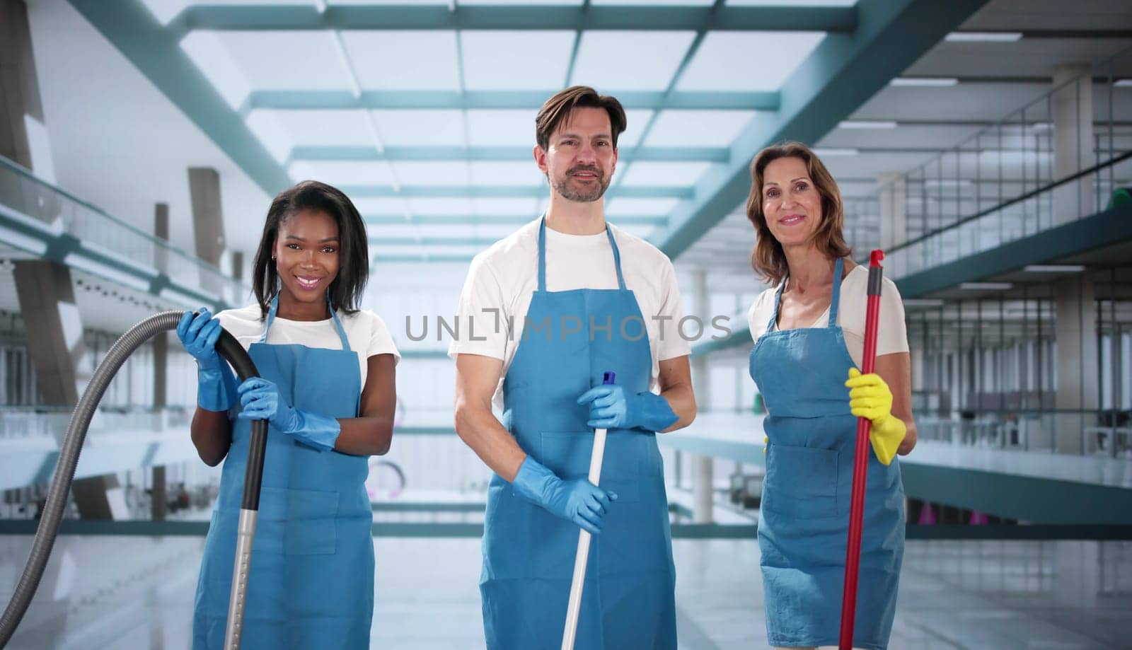 Busy Office Building Cleaning Crew: Diverse Team Keeping Workplace Spotless.