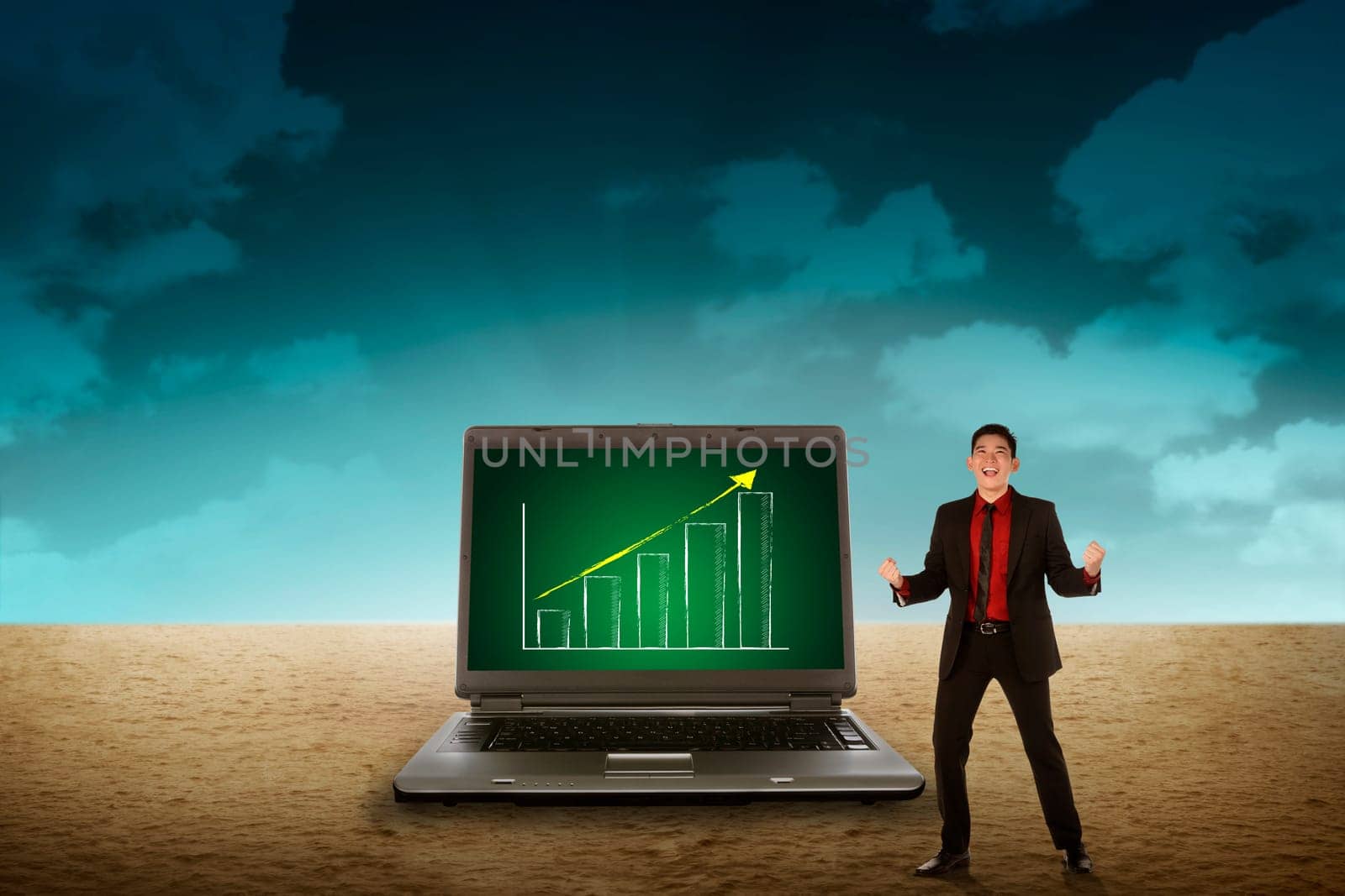 Business person looking giant laptop on the desert. Wireless concept