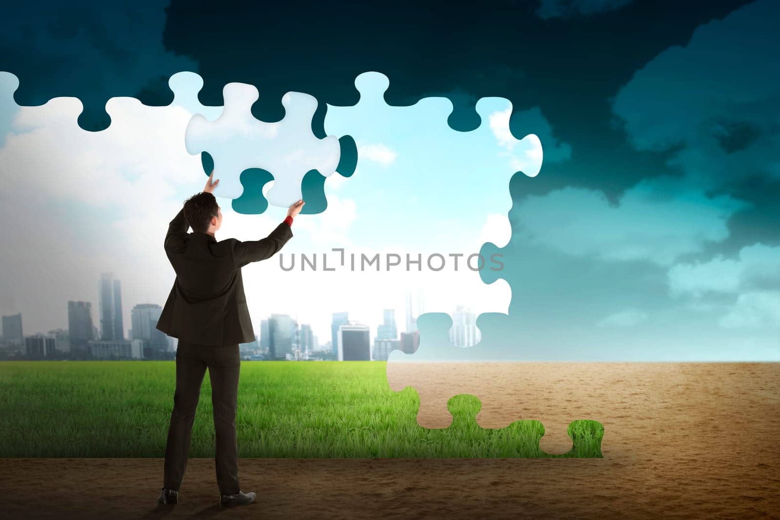 Business person building puzzle of city in the desert. Business building concept
