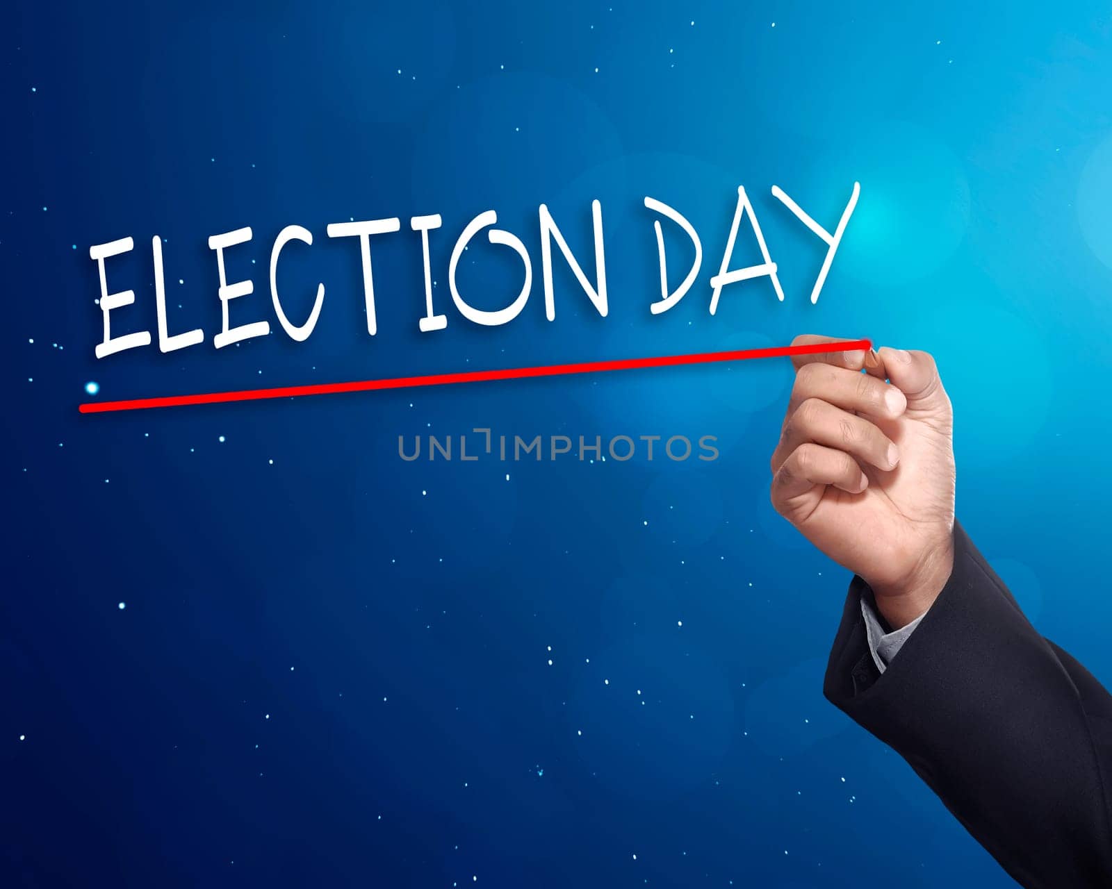 Man hand writing a 'ELECTION DAY' with gold marker on visual screen