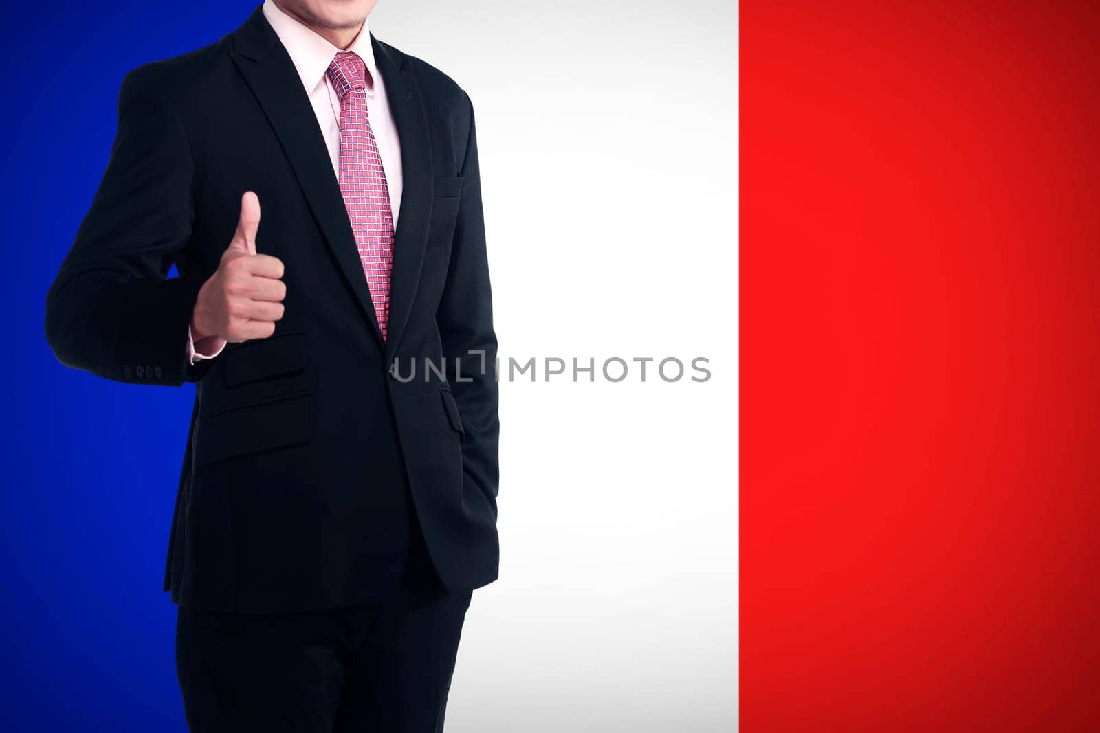 Man show thumb up with france flag behind him. Patriot concept
