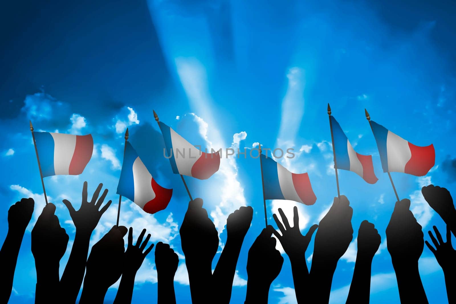 Group of people waving small france flag facing blue sky