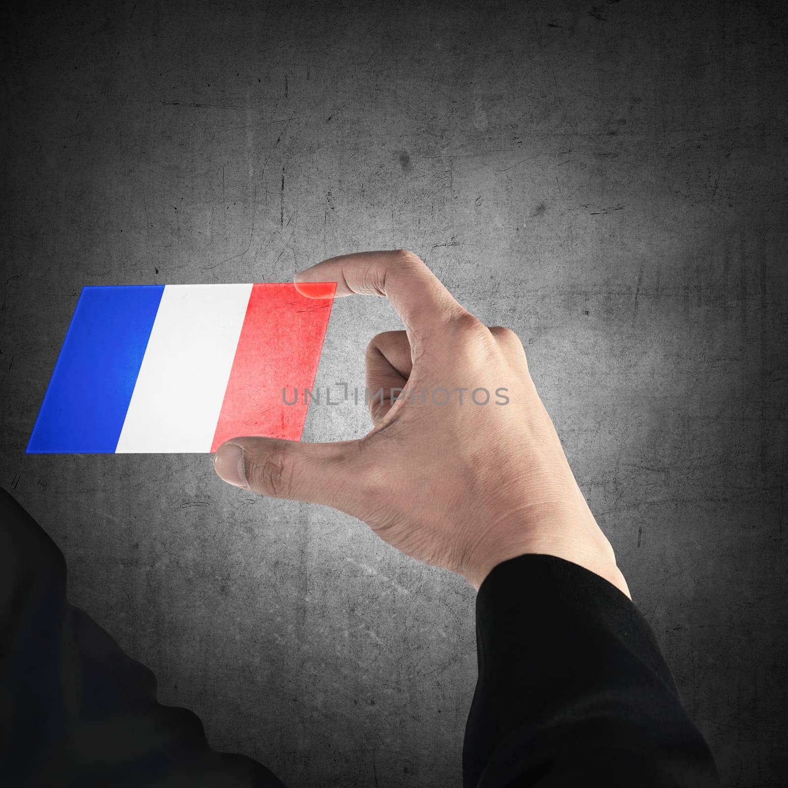 Man hand hold transparent card with france flag. Independence day concept
