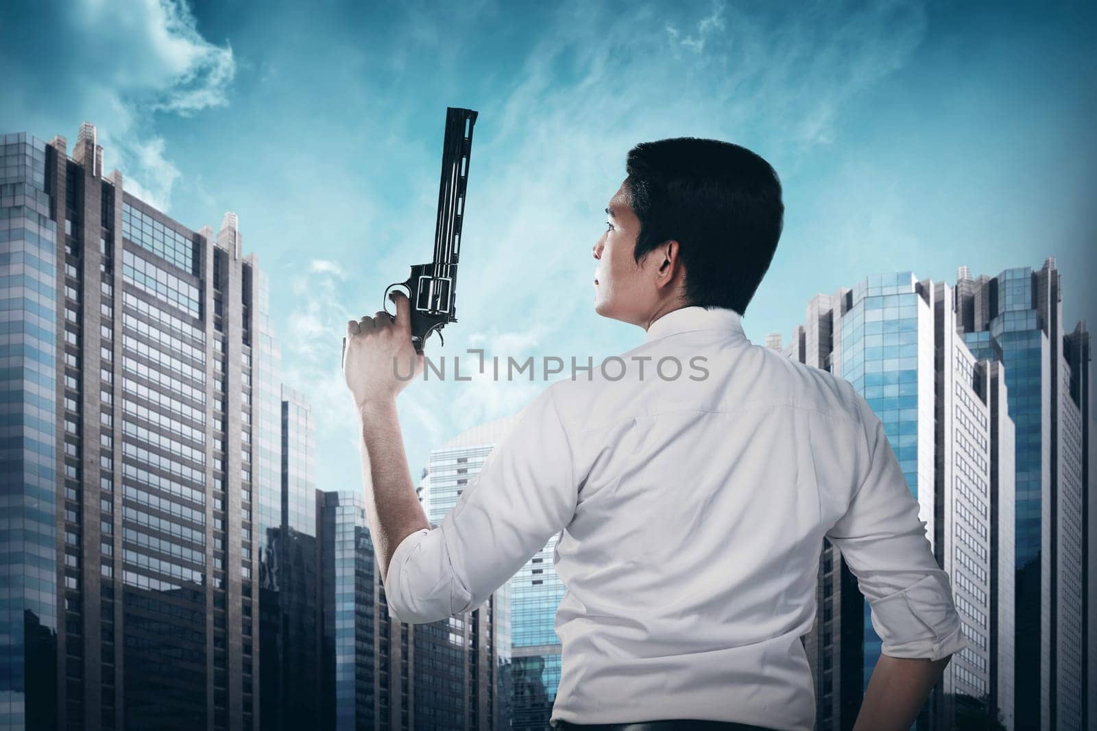 Secret agent holding gun ready to fire