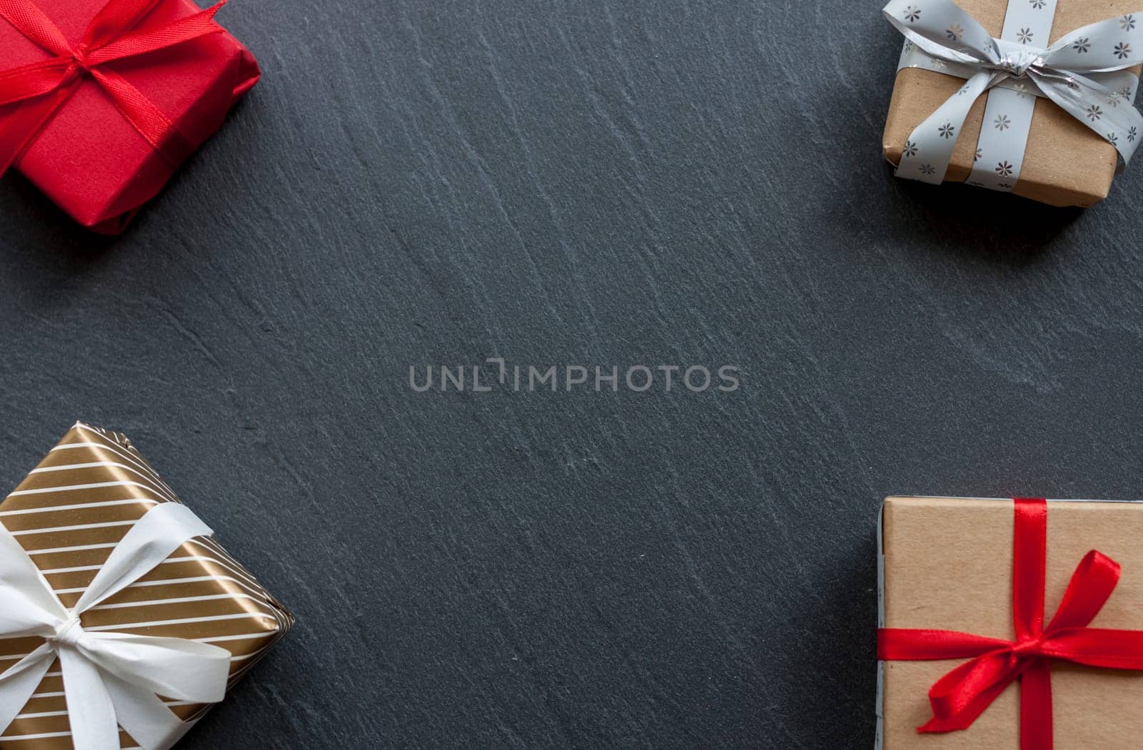 beautiful wraped gift boxes on black background