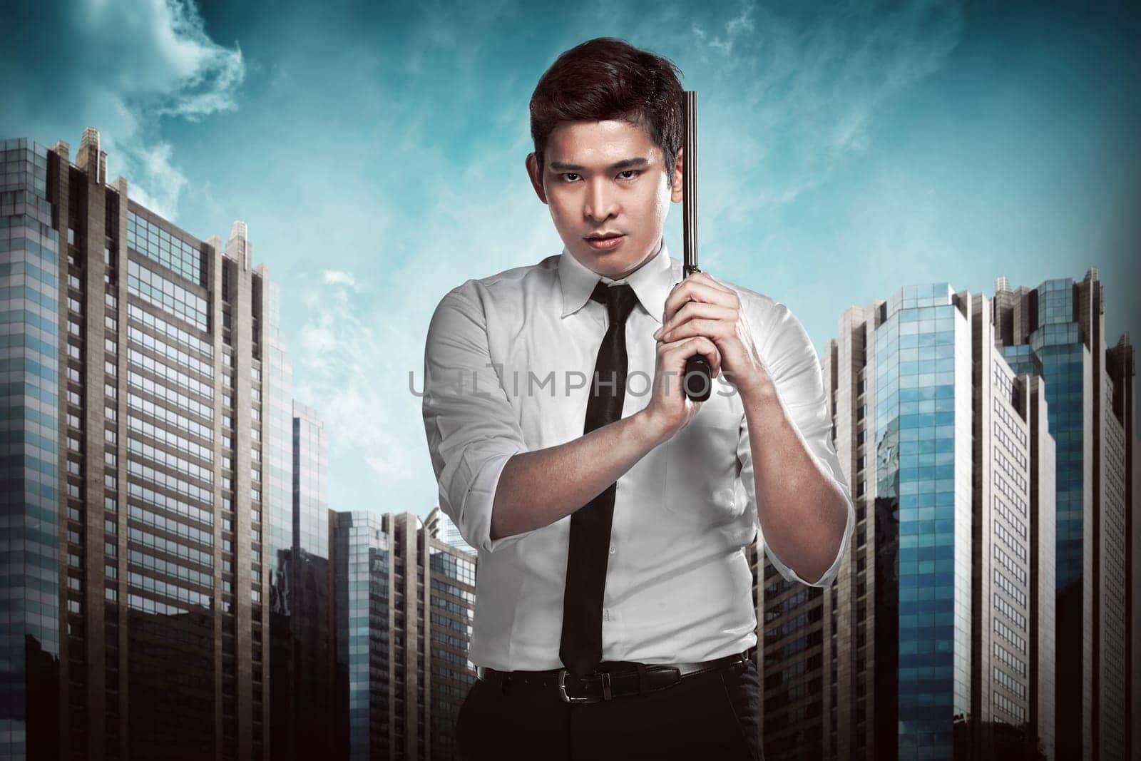 Secret agent holding gun ready to fire