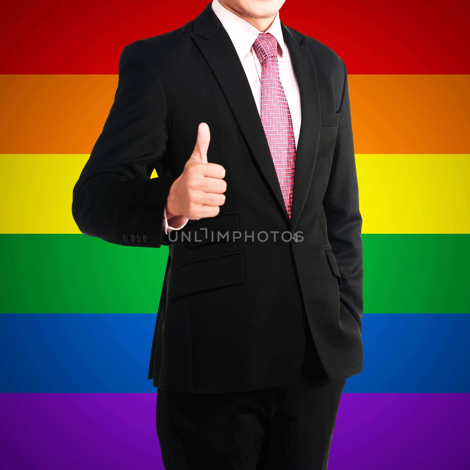 Business man show thumb up with gay rainbow flag background