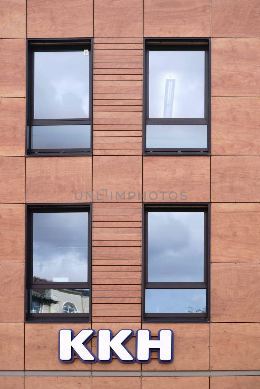Mainz,Germany - August 21,2017: The façade of the modern office building of the Kaufmännische Krankenkasse KKH with logo and office windows on August 21,2017 in Mainz.